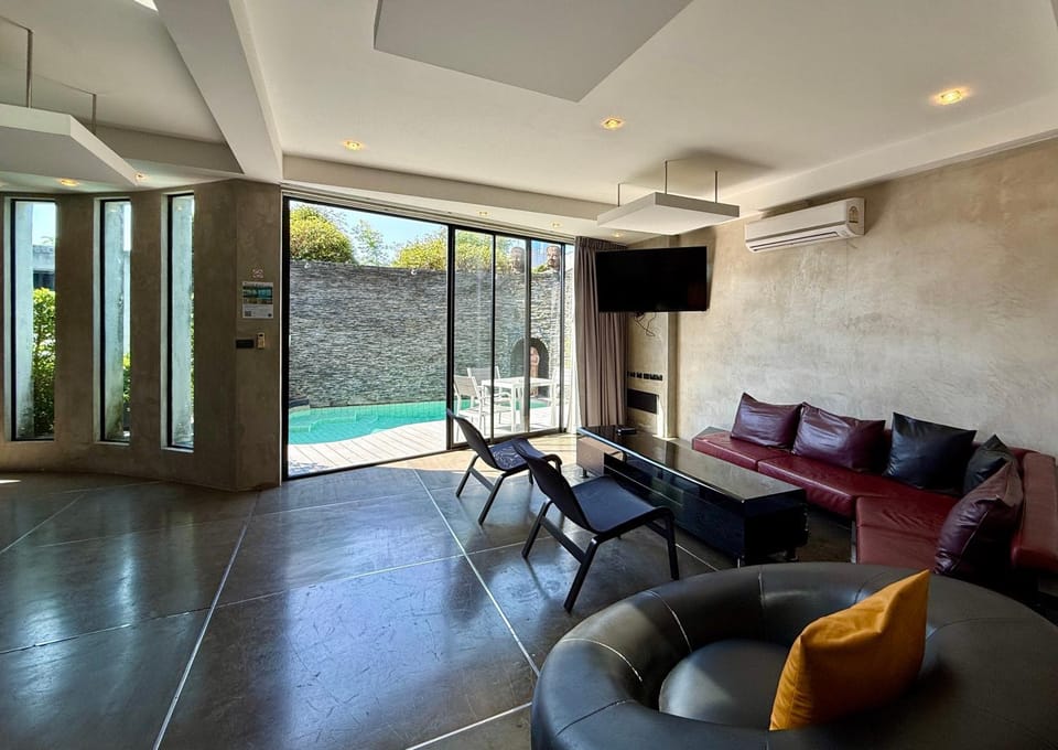 Living room, Seating area, Pool view