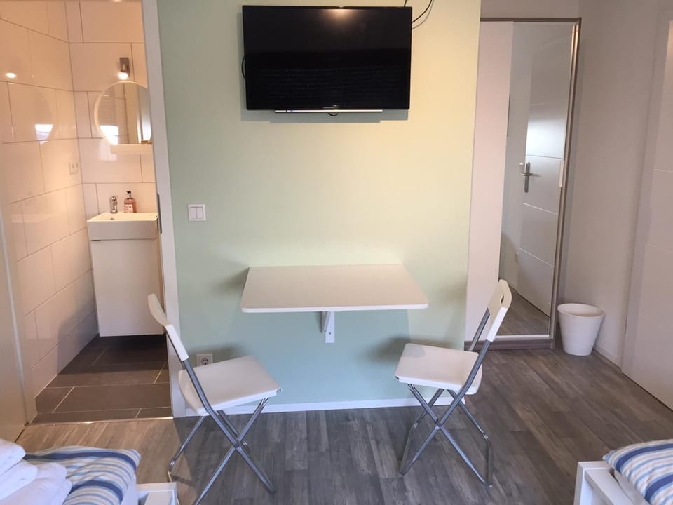 Communal lounge/ TV room, TV and multimedia, Living room, Photo of the whole room, Business facilities, Decorative detail, Seating area, Dining area, Meeting/conference room