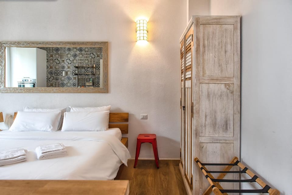 Bed, towels, wardrobe
