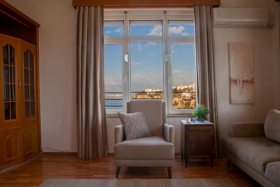 Natural landscape, View (from property/room), Living room, Seating area, Sea view