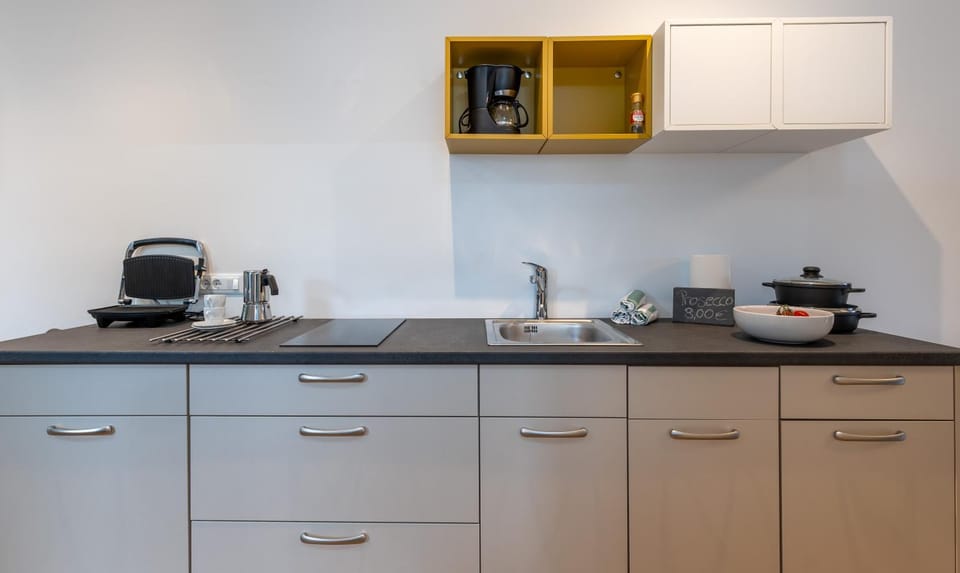 Kitchen or kitchenette, stove, toaster