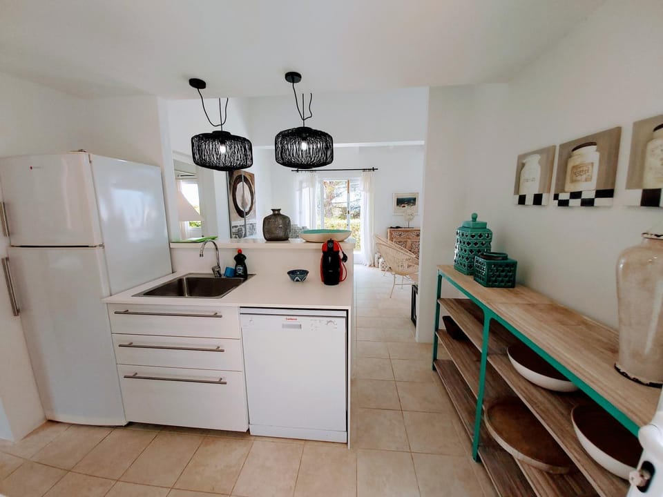 Kitchen or kitchenette, dishwasher, oven, stove