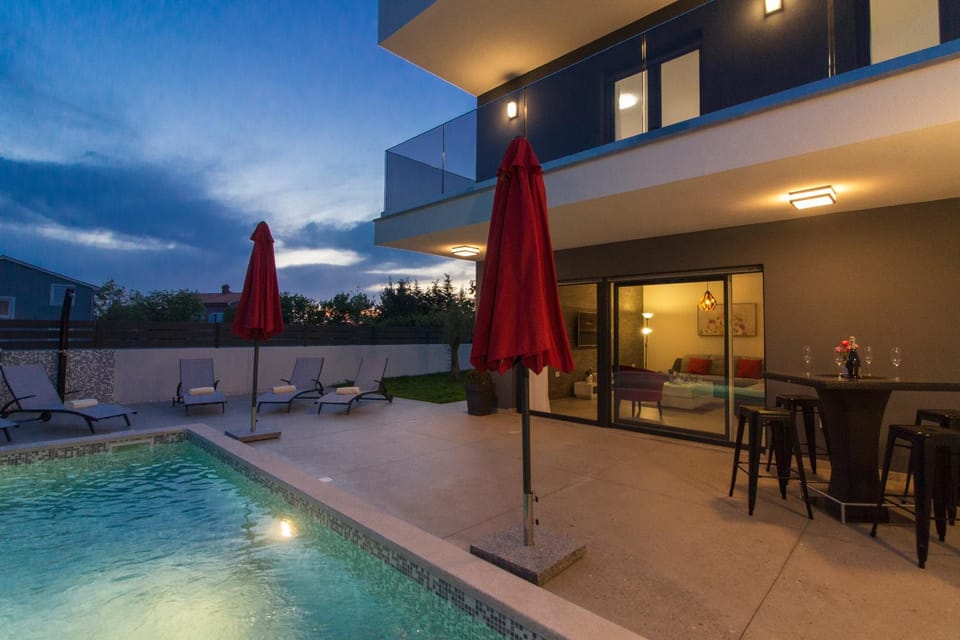 Property building, Night, Balcony/Terrace, Dining area, Pool view, Swimming pool, sunbed