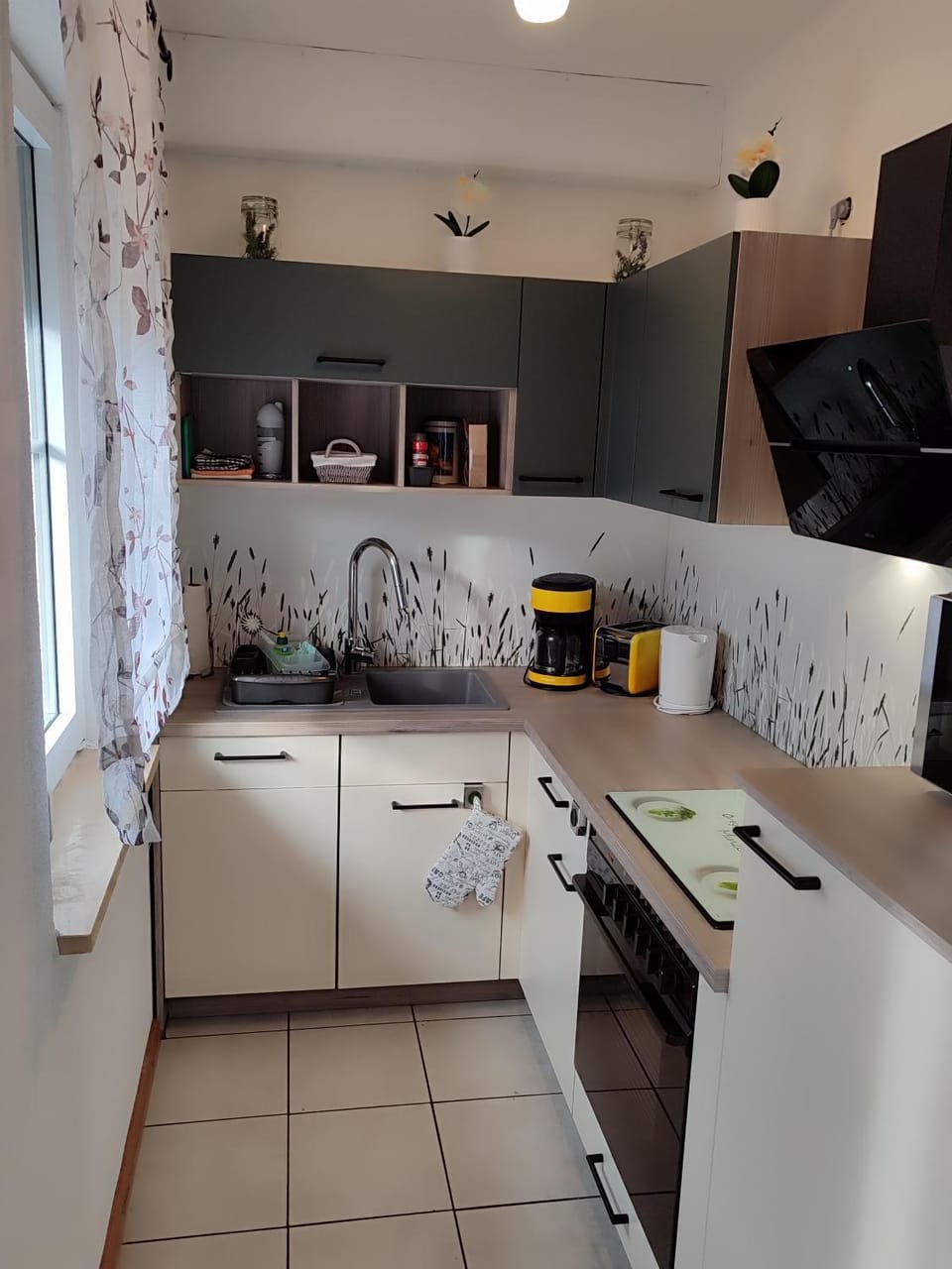 Kitchen or kitchenette, dishwasher, oven, stove, toaster