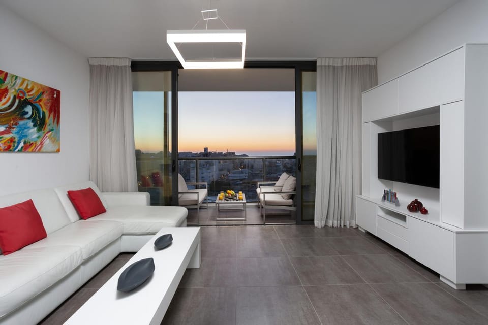 Balcony/Terrace, Living room, Seating area, City view, Street view, Sunset