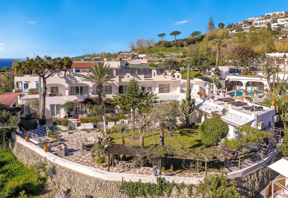 Property building, Nearby landmark, Facade/entrance, Spring, Natural landscape, Mountain view, Location