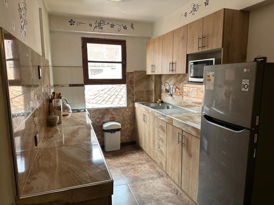 Kitchen or kitchenette, dishwasher, oven, stove