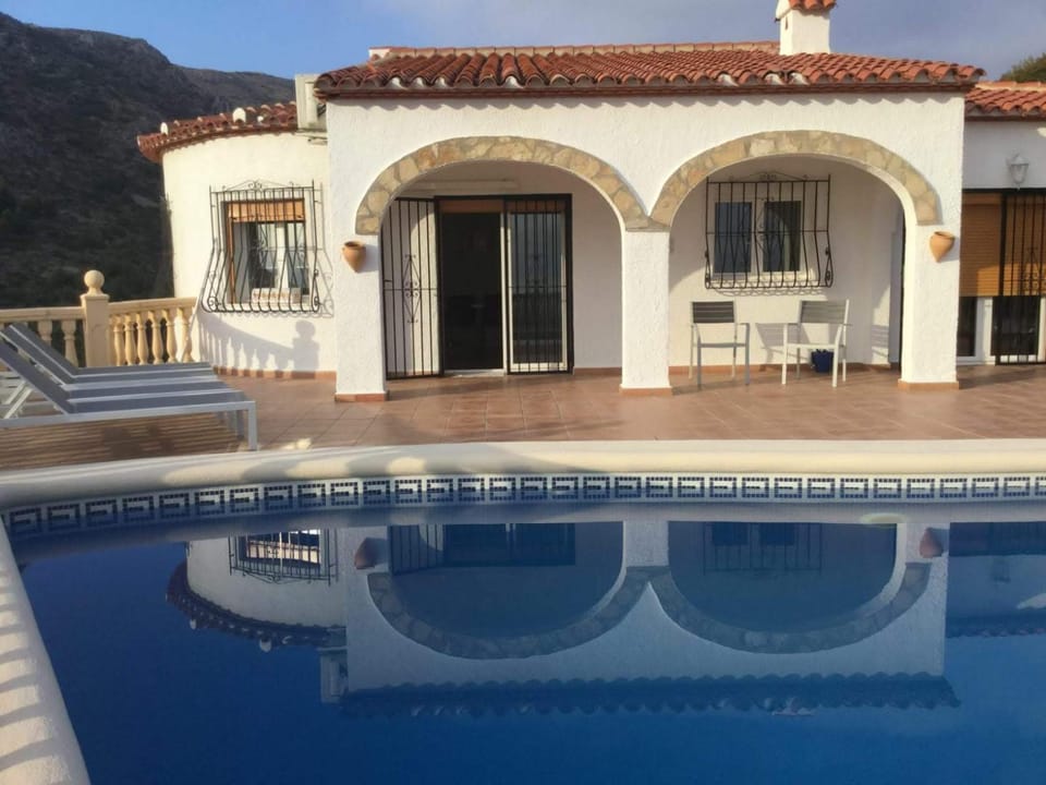 Property building, Patio, Pool view, Swimming pool, sunbed