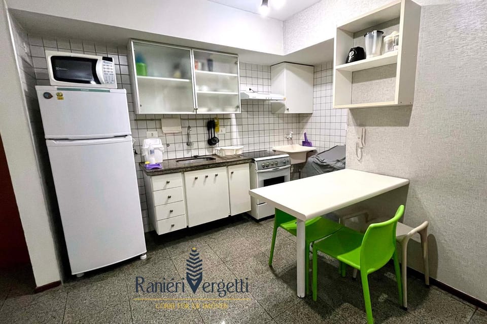 Kitchen or kitchenette, microwave, stove, washing machine