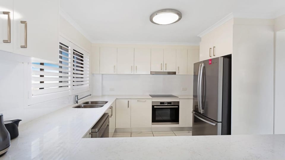 Kitchen or kitchenette, dishwasher, oven, stove