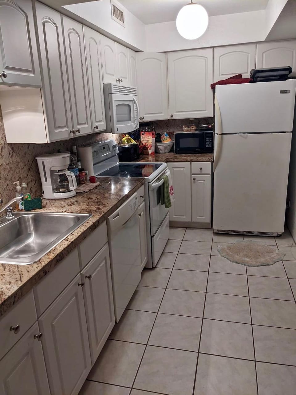 Kitchen or kitchenette, dishwasher, oven, stove