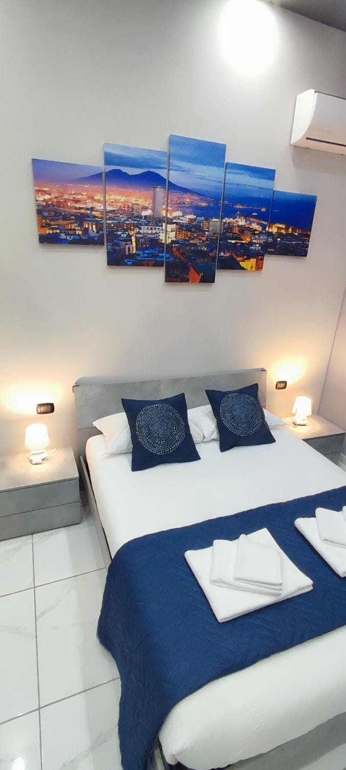Bed, Photo of the whole room, Bedroom, towels, air conditioner