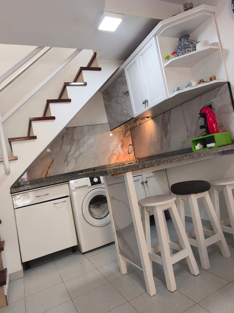 Kitchen or kitchenette, stove, washing machine