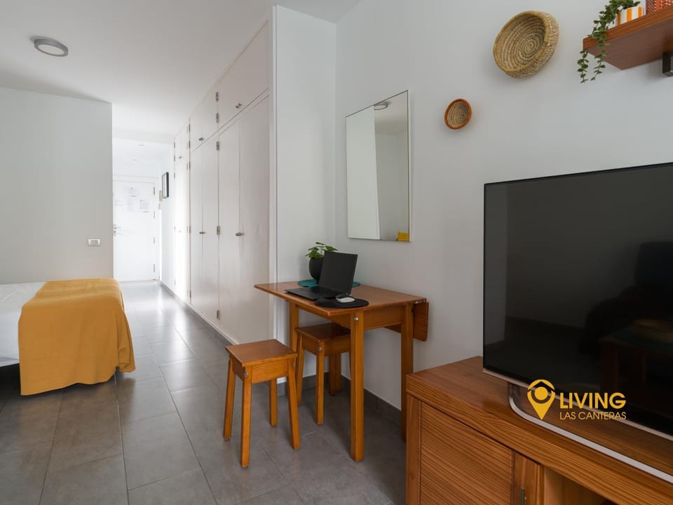 Bed, TV and multimedia, Seating area, wardrobe