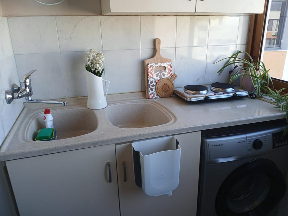 Kitchen or kitchenette, stove, washing machine