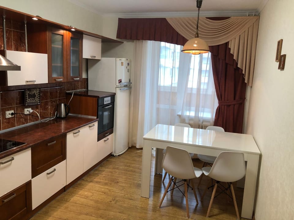 Kitchen or kitchenette, dishwasher, oven, stove