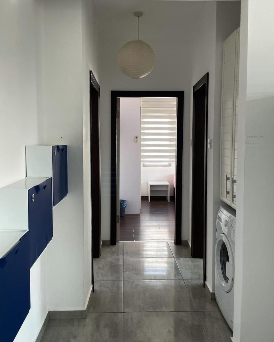 Photo of the whole room, washing machine