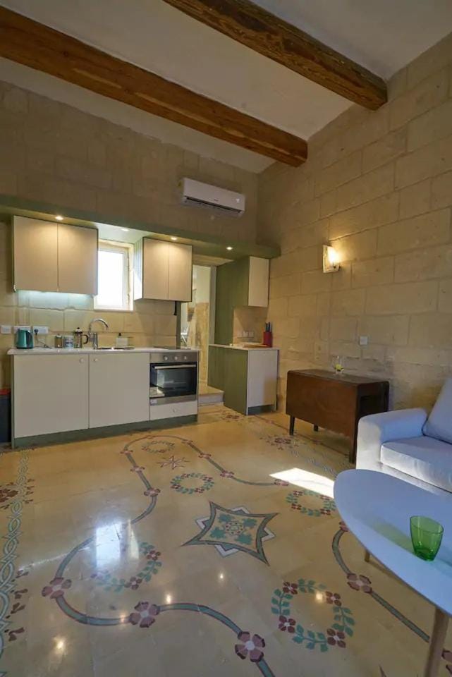 Kitchen or kitchenette, dishwasher, oven, stove