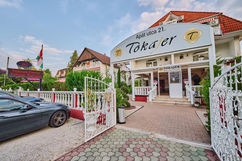 Property building, Facade/entrance, Day, Parking