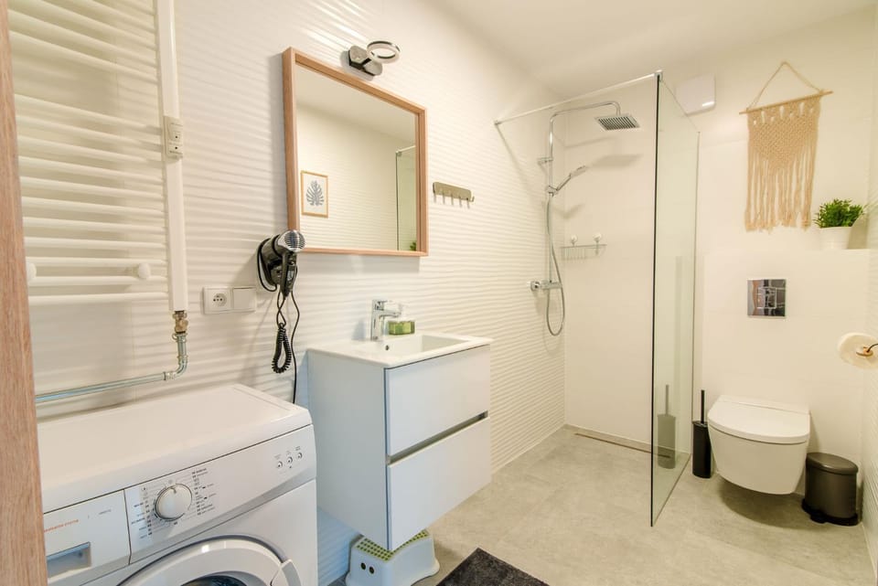 Shower, Toilet, Bathroom, towels, washing machine, dryer