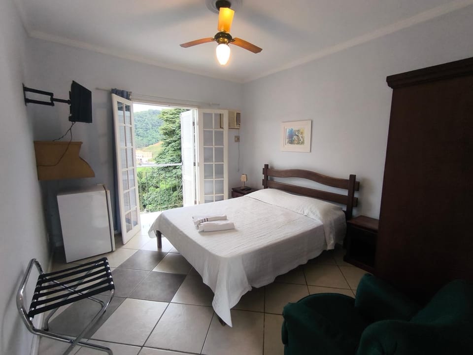 Property building, Bed, TV and multimedia, Photo of the whole room, Bedroom, Garden view, Mountain view, Swimming pool, towels, wardrobe