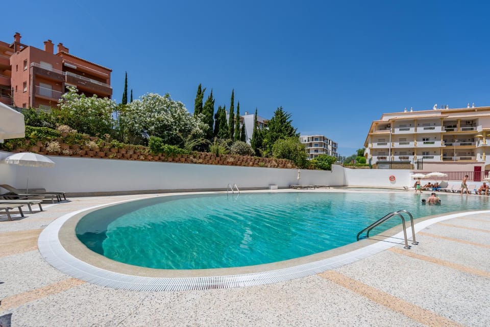 Property building, Day, Pool view, Swimming pool, sunbed