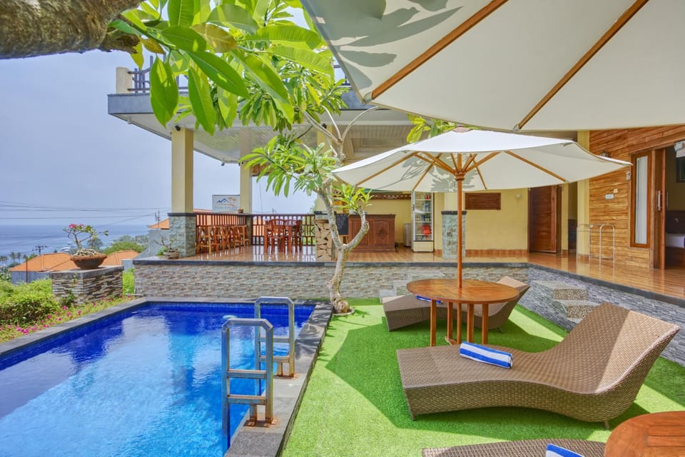 Property building, View (from property/room), Balcony/Terrace, Seating area, Pool view, Sea view, Swimming pool, sunbed