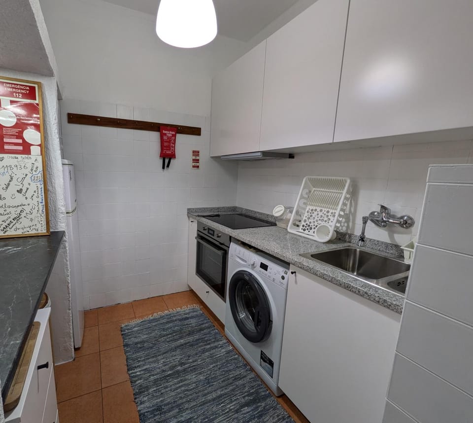 Kitchen or kitchenette, oven, stove, washing machine