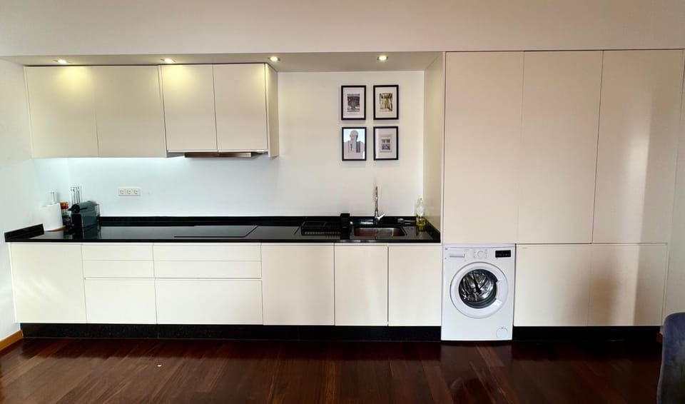 Kitchen or kitchenette, stove, washing machine