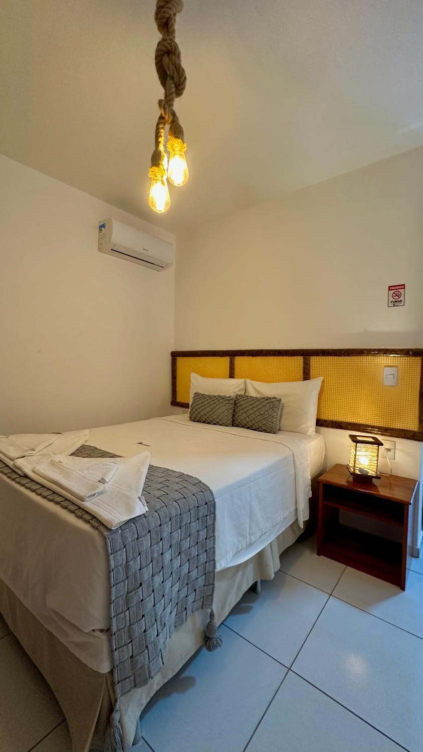 Bed, Photo of the whole room, Bedroom, towels, air conditioner