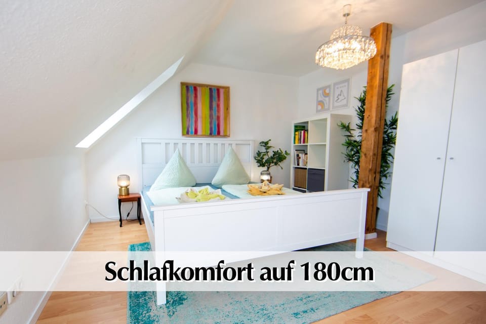 Bed, Property logo or sign, Photo of the whole room, Logo/Certificate/Sign, Bedroom, Text overlay, Certificate/Award