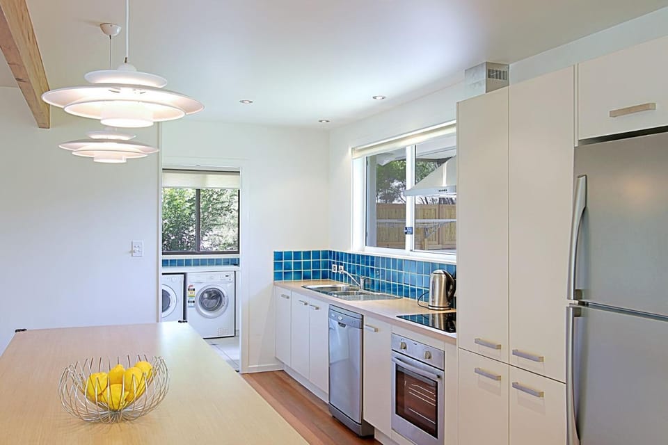 Kitchen or kitchenette, laundry, washing machine, dryer