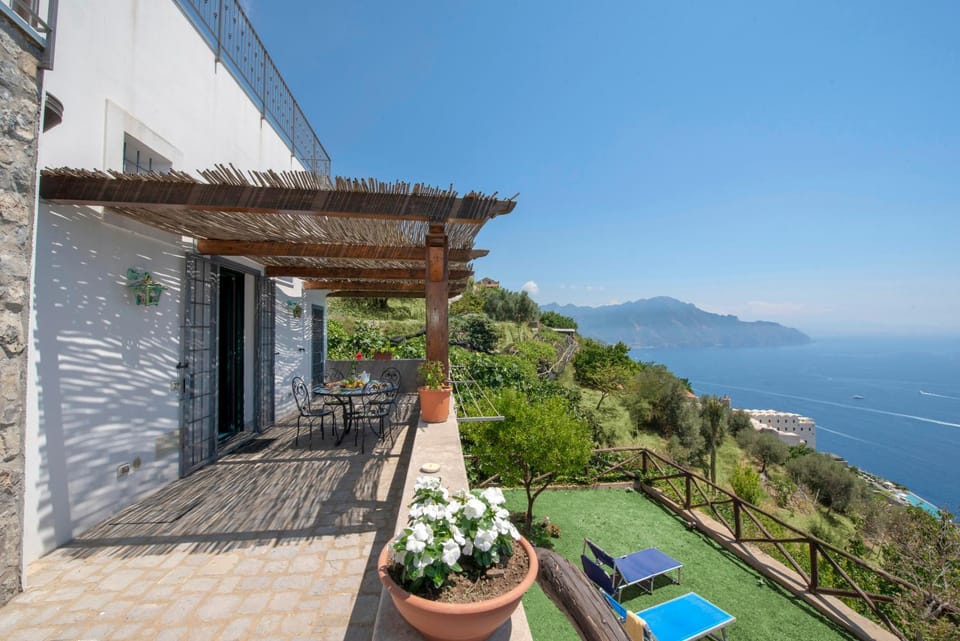 Property building, Patio, Natural landscape, Balcony/Terrace, Mountain view, Pool view, Sea view, sunbed
