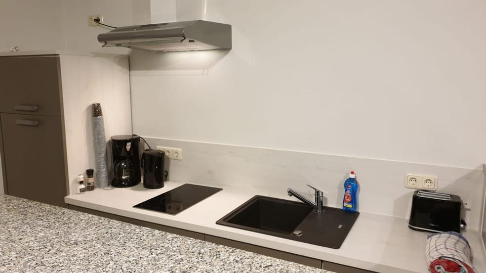 Kitchen or kitchenette, stove, toaster