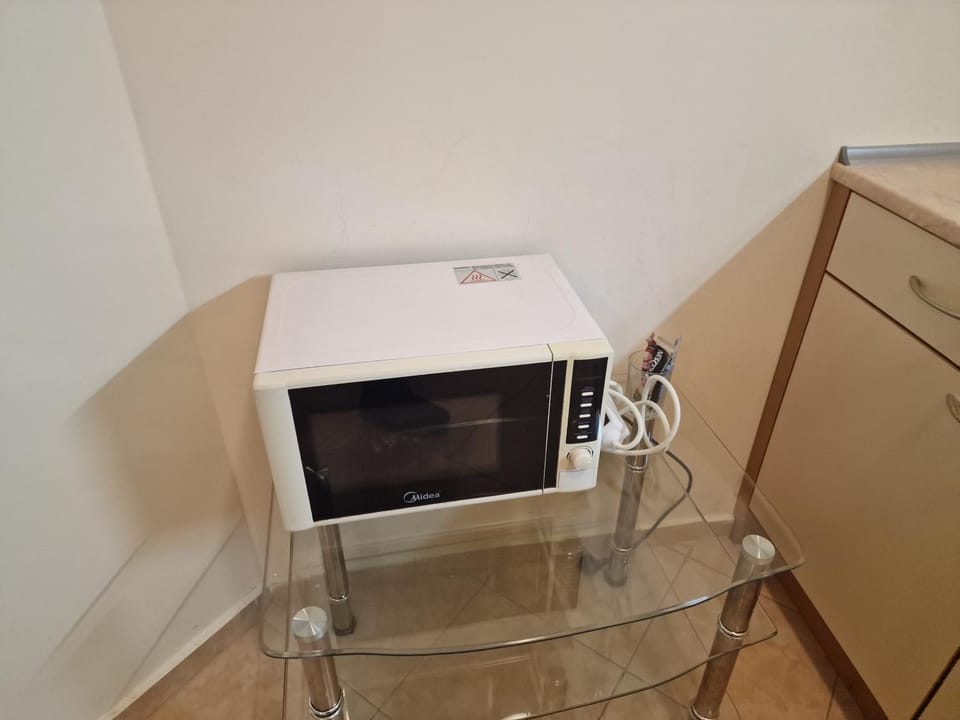 Kitchen or kitchenette, microwave