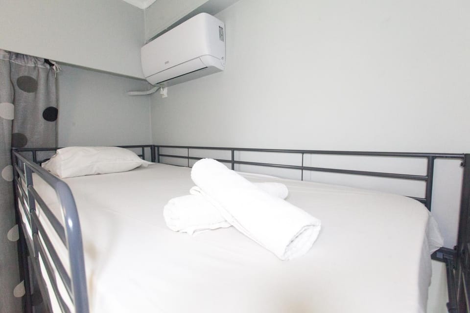 Bed, Photo of the whole room, Bedroom, bunk bed, towels, air conditioner