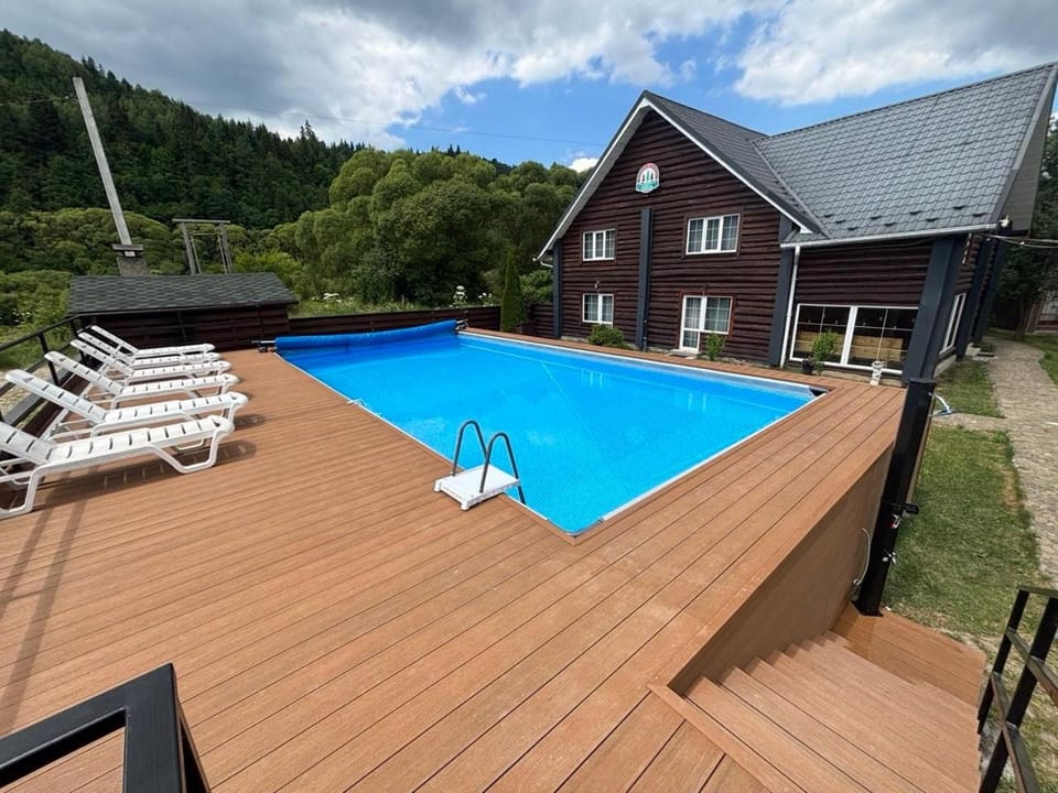 Property building, Day, Pool view, Swimming pool, sunbed