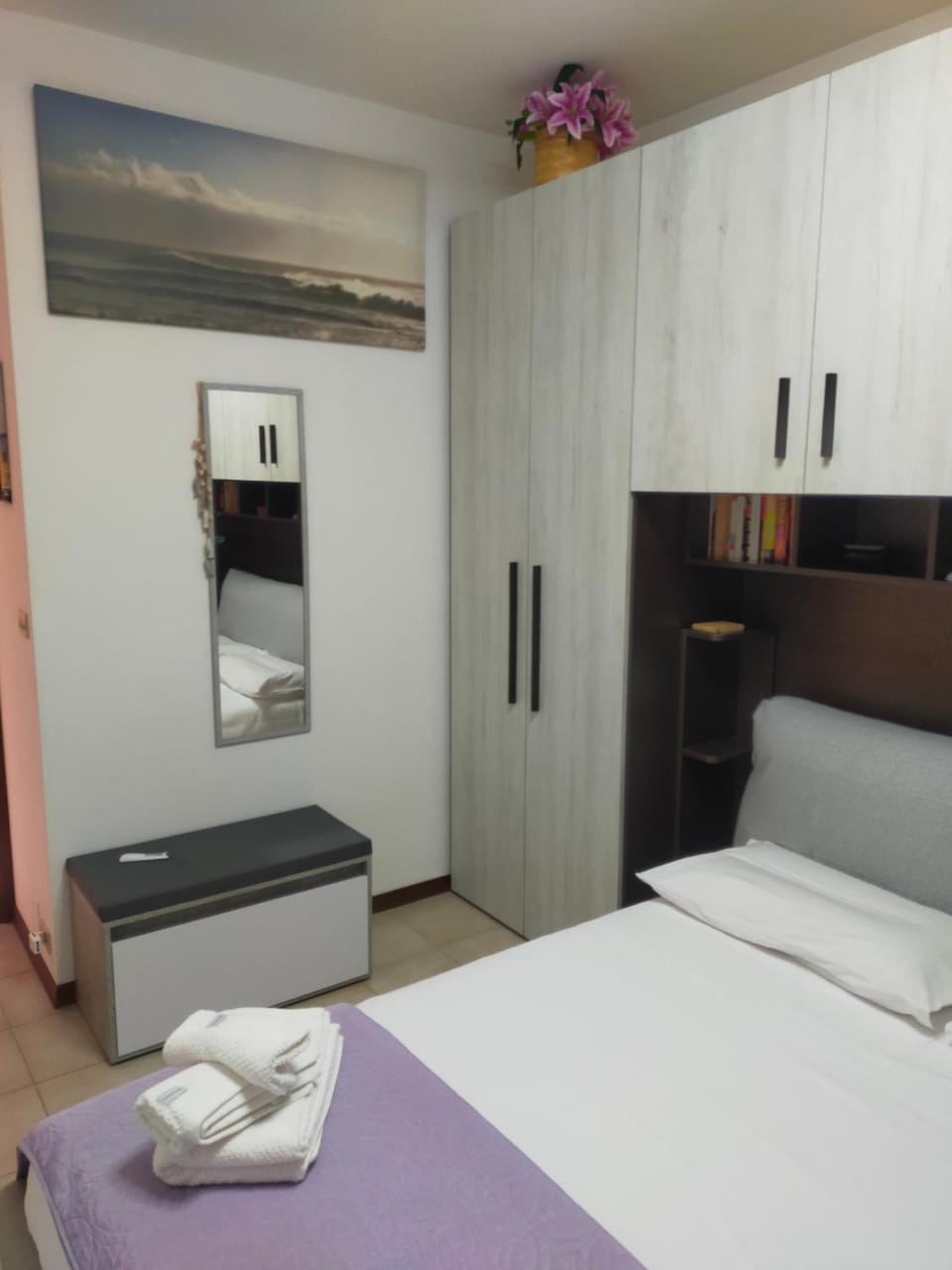 Bedroom, microwave, towels, wardrobe