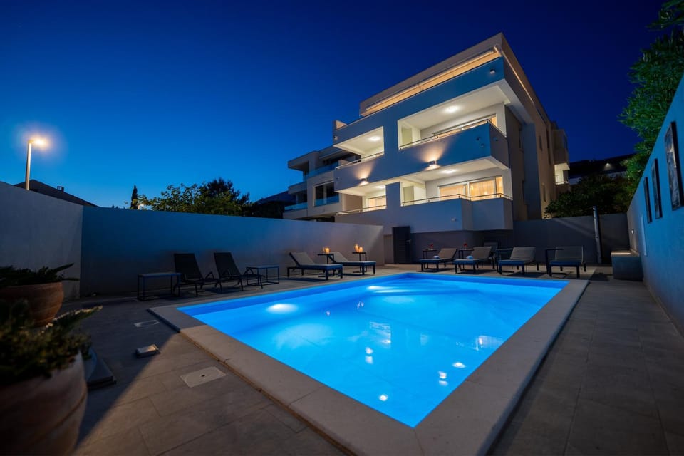 Property building, Night, Pool view, Swimming pool, sunbed
