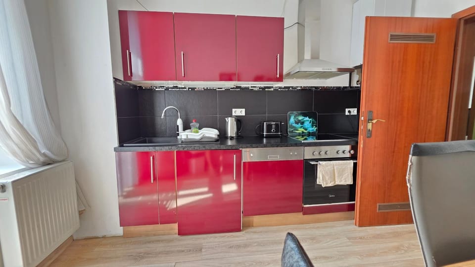 Kitchen or kitchenette, dishwasher, oven, stove, toaster