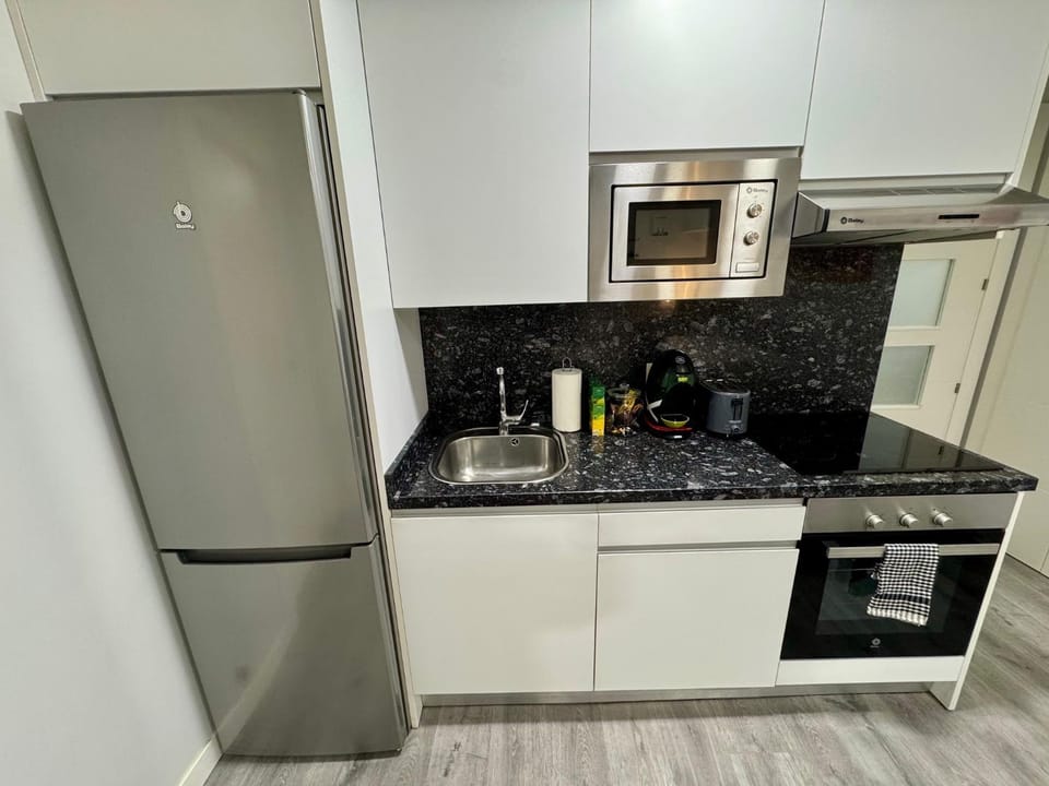 Kitchen or kitchenette, oven, stove