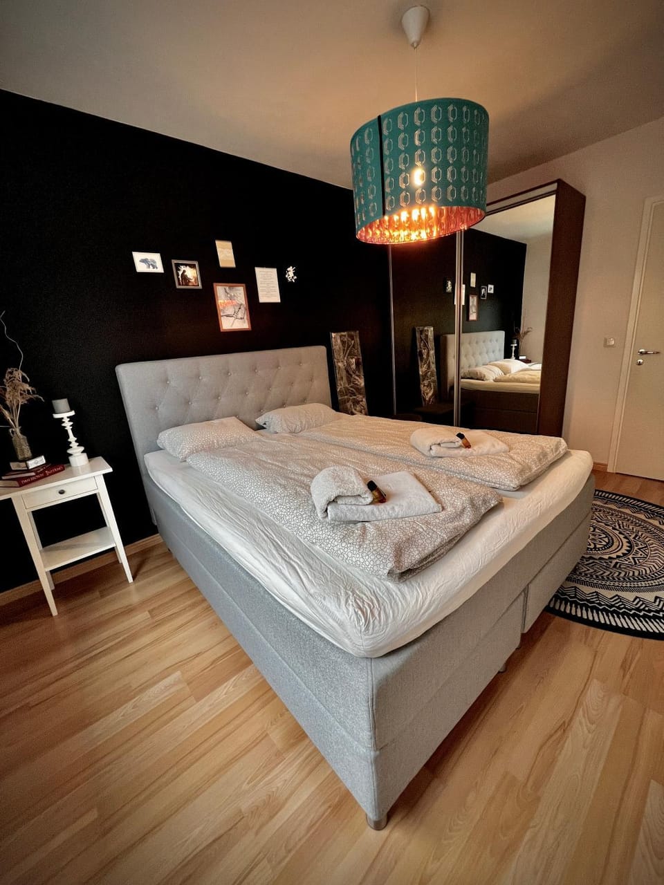 Bed, towels, wardrobe