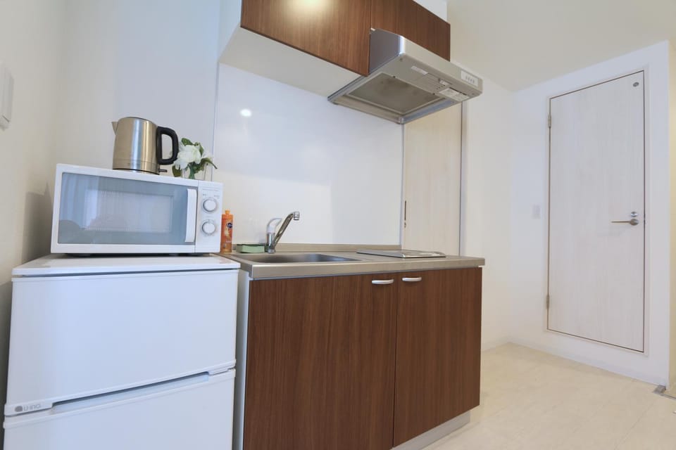 Kitchen or kitchenette, microwave, stove, kitchen