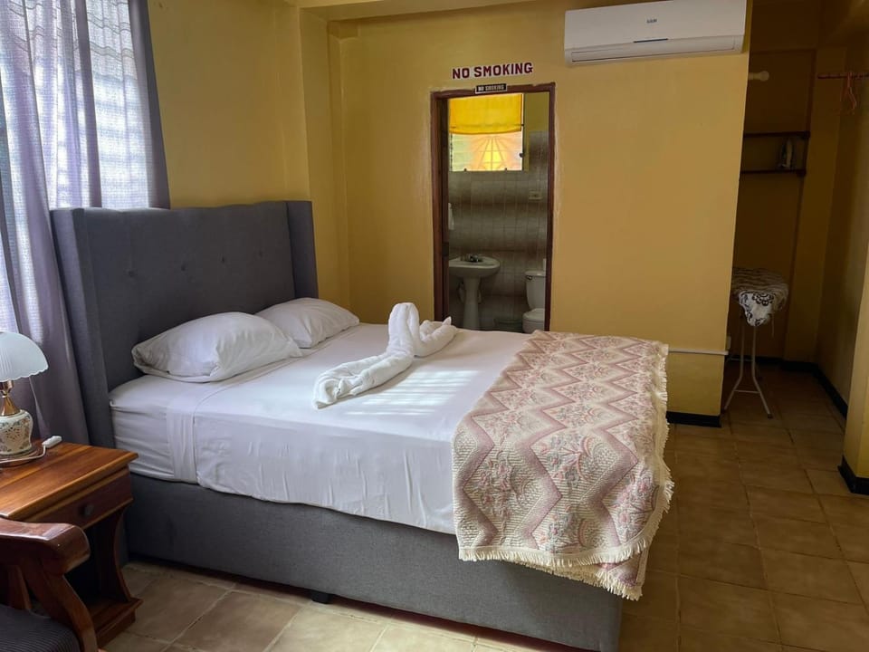 Bed, Photo of the whole room, Bedroom, towels, air conditioner