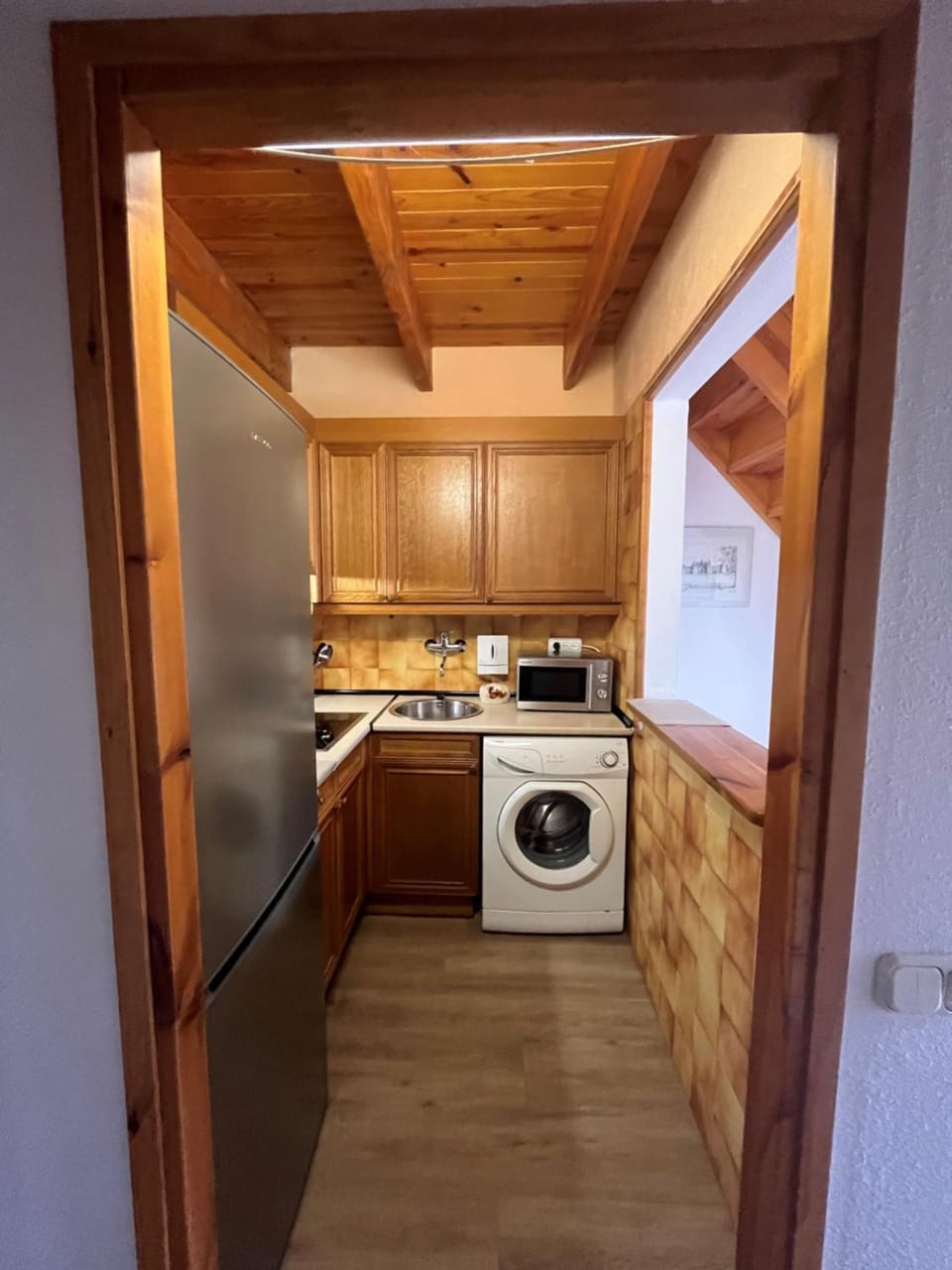 Kitchen or kitchenette, washing machine