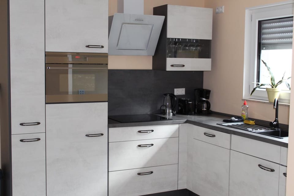 Kitchen or kitchenette, dishwasher, oven, stove, toaster