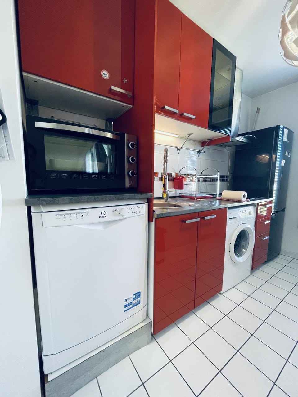 Kitchen or kitchenette, dishwasher, oven, stove, washing machine