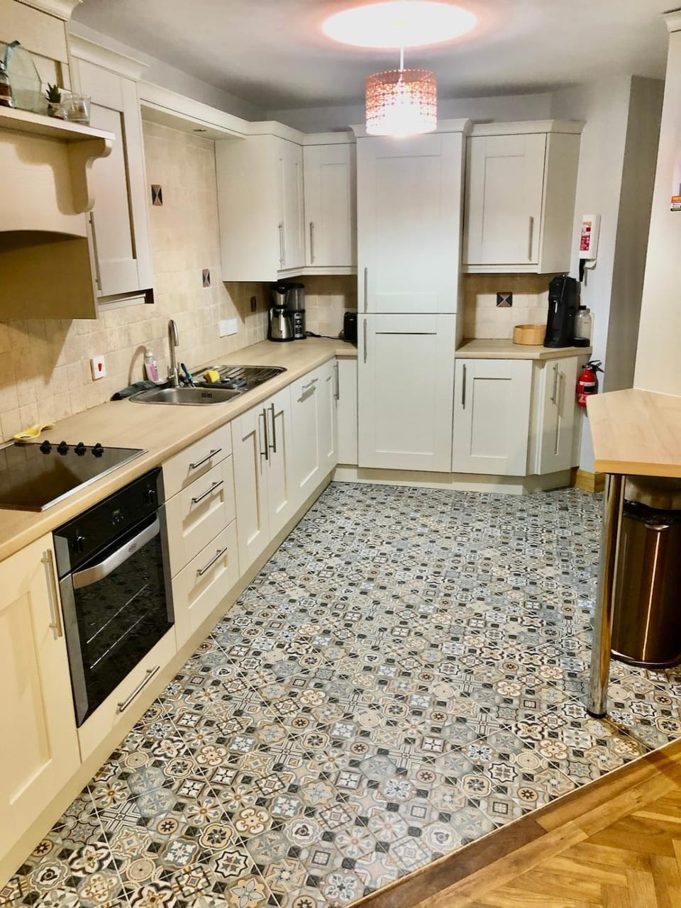 Kitchen or kitchenette, dishwasher, oven, stove