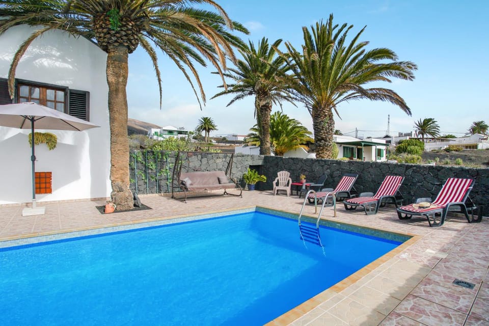 Property building, Living room, Swimming pool