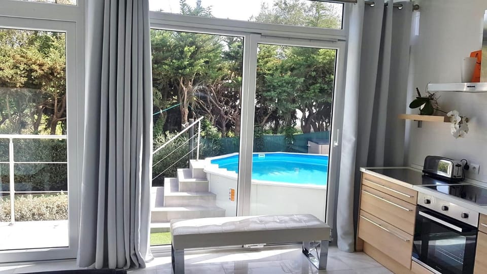 Kitchen or kitchenette, Living room, Garden view, Pool view, Swimming pool